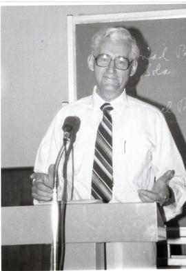 Victor Adrian speaking in a classroom