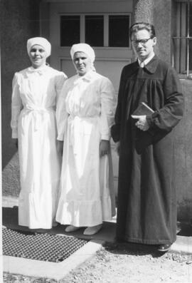 Abram J. Neufeld with baptism candidates