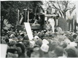 Riding a tractor at a protest rally
