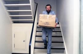 Carrying boxes down stairs