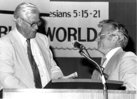 David E. Redekop and John Eckert behind the pulpit