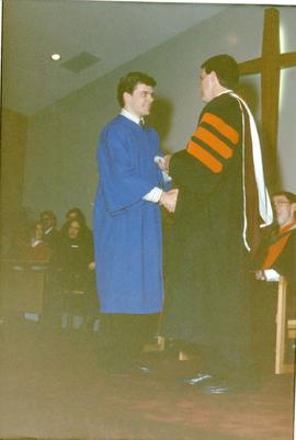 James Pankratz giving Julian Regehr his diploma
