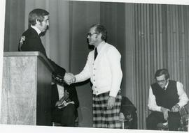Henry Petkau shaking hands with Wilmer Kornelson