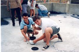 Jeff Enns and friend tarring roof
