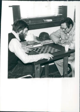 Jack Cosens & Edgar Kitchemonia enjoy a checker game