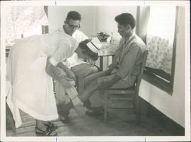 Miss Toews, nurse, Dr. Hans Epp, patient, at La Esparanza clinic