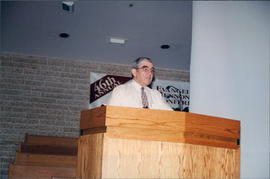 Harvey Plett addressing Ministerial Meeting