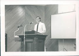 Lester Kroeker, youth pastor, leading Sunday morning service - 2 pictures