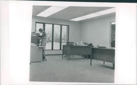 Interior view of new office building with Martha Kroeker at files