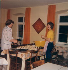 Lillie Penner, left, baking buns at Black Forest Academy