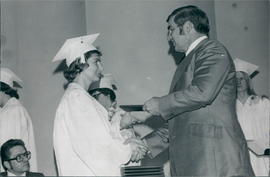 Pearl Plett receiving degree from President (& husband) Harvey Plett
