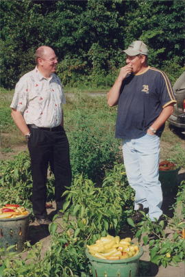 Pastor John Wall, minister and farmer Ike Froese