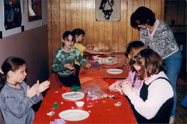Children in mixed age class working with crafts during Sunday school