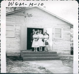 Group on steps of church. Rear, left, Pastor Dave Dueck; front, Elizabeth Rempel on left, Lydia D...