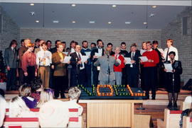 Male choir singing under the direction of Peter Hiebert at Christmas service