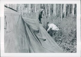 Dan Koop and Milton Fast setting up tents for overflow crowd - 2 pictures