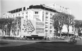 Large corner building in an unidentified urban area in Vietnam (Saigon?)