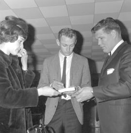 John Kampen (centre), on Mennonite Yourth Organization executive with Mr. & Mrs. Cal Moore