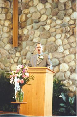 Henry Paetkau speaking at 40th anniversary event
