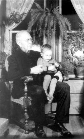 S.F. Coffman in rocking chair with John Henry Coffman