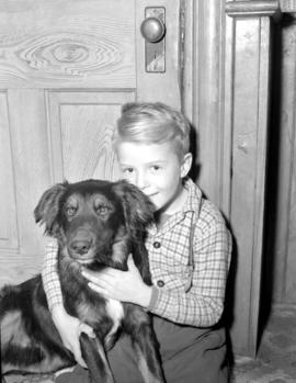 Billy Cummings, age six, with his dog Rowdy, who saved Billy