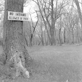 "No Indians allowed in park" sign