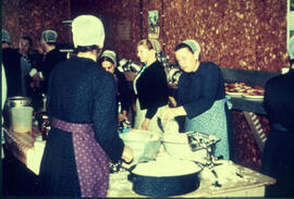 Women preparing meal for barn raising crew
