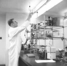 Don Harder with lab equipment
