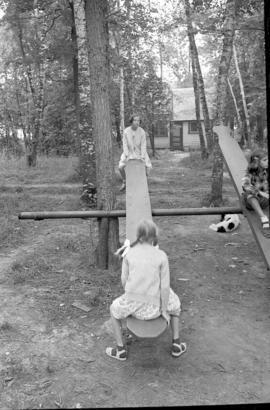 Girls on the teeter-totter at Chesley Lake Camp