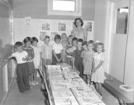 Mrs. C. N. Friesen with her class of (grade 3?) children