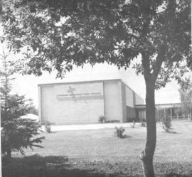 View of end of Canadian Mennonite Bible College building with school insignia