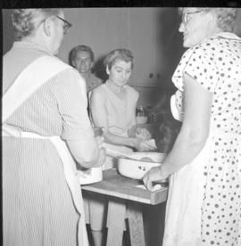 Women preparing food in the kitchen at the CMC annual conference