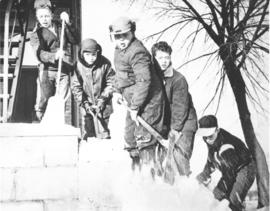 Five boys from the Ailsa Craig Boys Farm shoveling snow