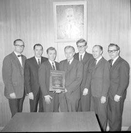 Semi-formal. Presentation of a plaque to D.W.