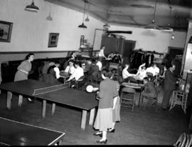 Evening events of ping pong, crokinole and and socializing at Goodwill Hall in Kitchener, Ontario
