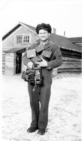Man carrying several cameras
