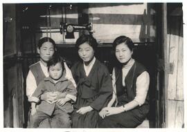 MCC widows' sewing project November 28 1962 graduate Choi Jang Hi with her family and new sewing ...