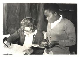 Jean Snyder and another in the library at Tumu Tumu Girls' High school