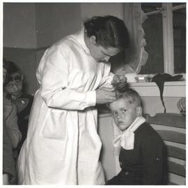 Child being inspected for lice at Bad Duerkheim Children's Home