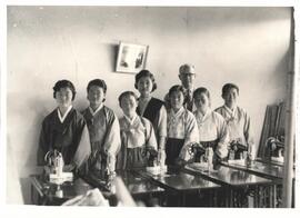 Graduating class of the MCC widows' sewing project on November 28, 1962 with John Zook, director ...