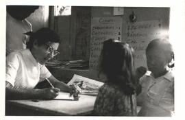MCC Voluntary Service worker Rosemary Wyse registering children for the YMCA clinic at Tepoztlan