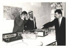 Norman Lind adjusting the sound for Mr. Kamal who is listening to the first Mennonite tape to be ...