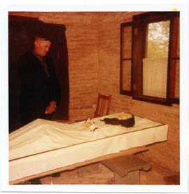 Peter W. Buhler beside the coffin of his wife Eva