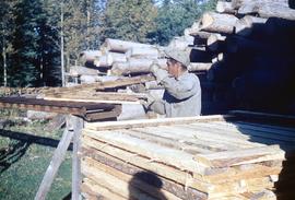 A man works at the Matheson Island Lumber mill