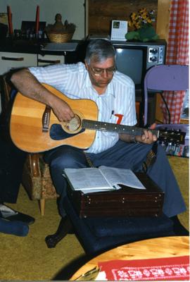 Neill playing guitar, Riverton