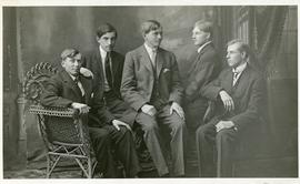 Five young men in fine suits