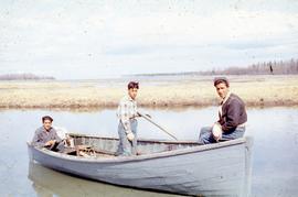 Three men in a fishing boat