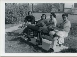 Four men on bench, Inter-Church Seminar