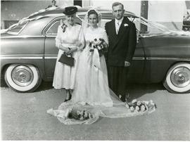Wedding picture containing bride's mother, bride, and bride groom