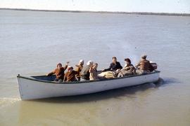 Family coming to visit Klippenstein's by boat in Matheson Island, Manitoba